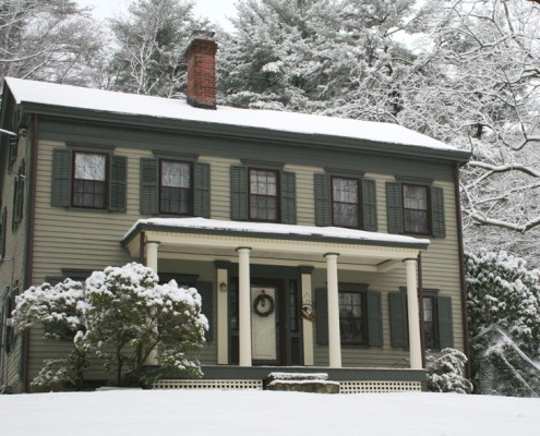 Federal style house in snow